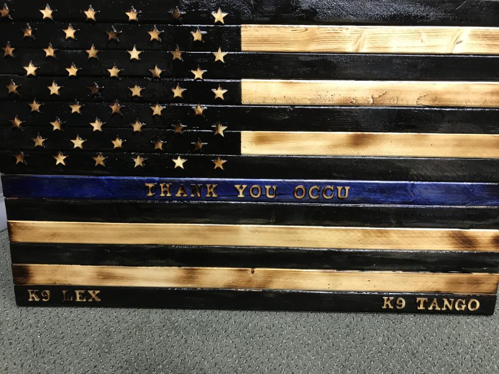 hand made american flag art, thanking OCCU from the City of Shelton K9 unit